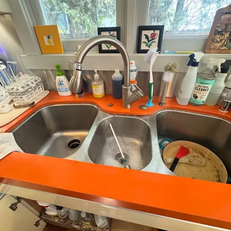 Compact reverse osmosis system installed beneath a kitchen sink